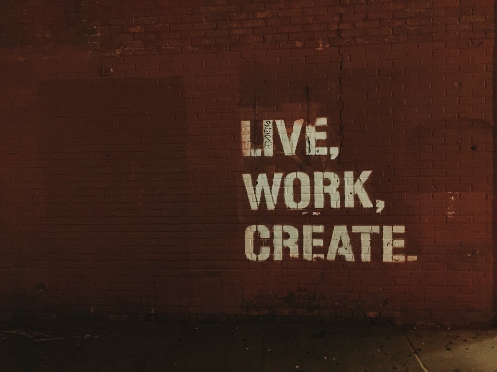 Live, work, create spraypainted on a brick wall.